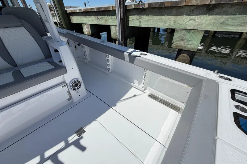Slide: The Image of 2026 Everglades 395 Center Console boat interior, featuring sleek seating and modern design. - 31