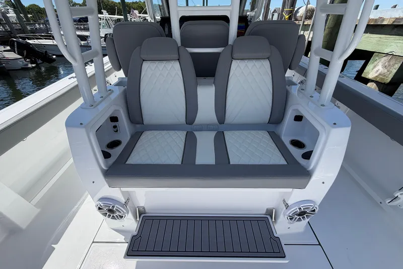 Slide: The Image of 2026 Everglades 395 Center Console boat seating with gray and white upholstery. - 39