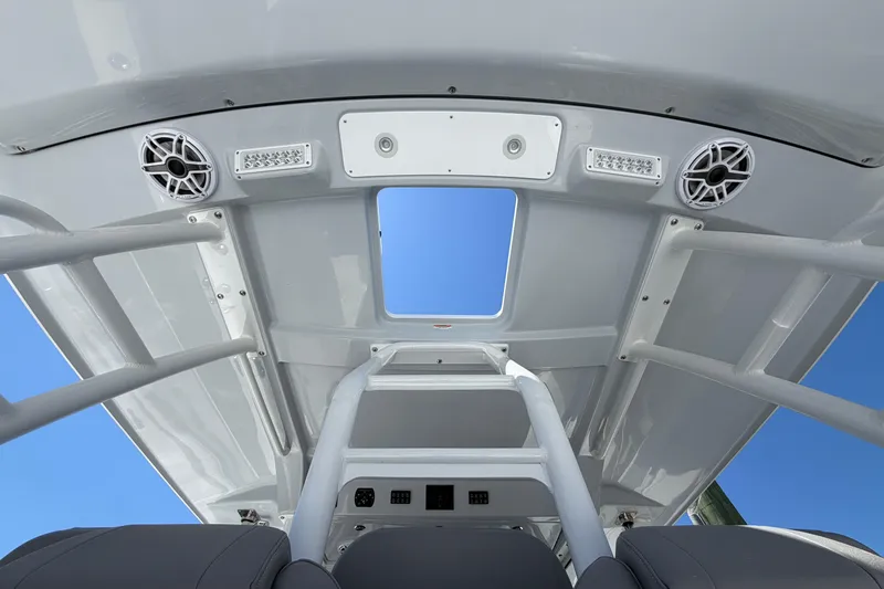 Slide: The Image of 2026 Everglades 395 Center Console boat interior with speakers and lighting fixtures. - 41