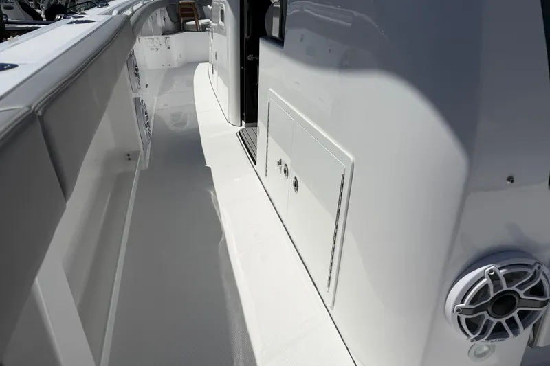 Slide: The Image of 2026 Everglades 395 Center Console boat interior with sleek white design and modern features. - 44