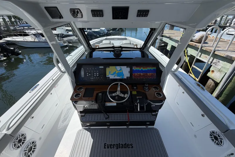 Slide: The Image of Helm of 2026 Everglades 395 Center Console boat with advanced navigation displays. - 50