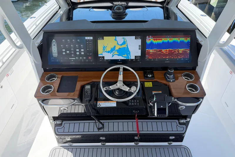 Slide: The Image of Helm of 2026 Everglades 395 Center Console with advanced navigation displays and controls. - 51