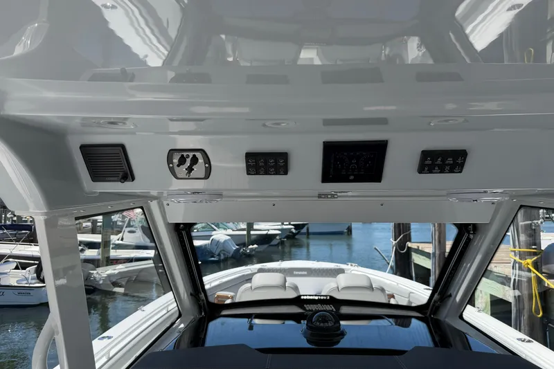 Slide: The Image of Interior view of 2026 Everglades 395 Center Console boat dashboard at marina. - 55