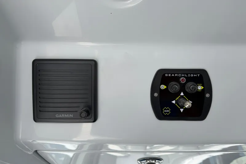 Slide: The Image of Control panel of 2026 Everglades 395 Center Console with Garmin and searchlight controls. - 56