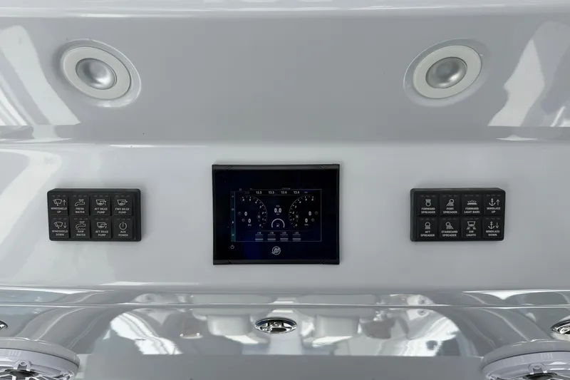 Slide: The Image of Control panel of 2026 Everglades 395 Center Console boat with digital display and buttons. - 57
