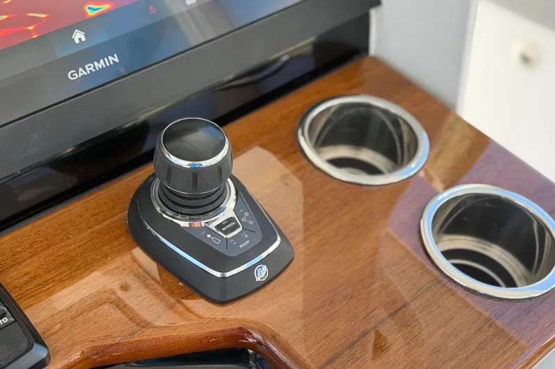 Slide: The Image of Control panel of 2026 Everglades 395 Center Console with Garmin display and joystick. - 63
