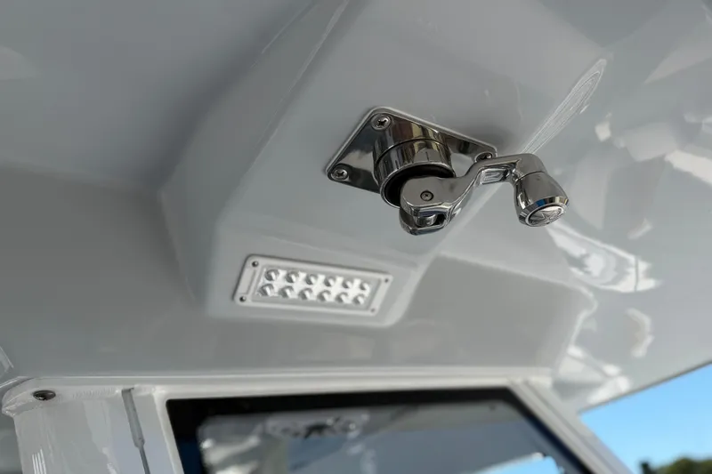 Slide: The Image of Ceiling detail of 2026 Everglades 395 Center Console boat with chrome fixture and LED light. - 70