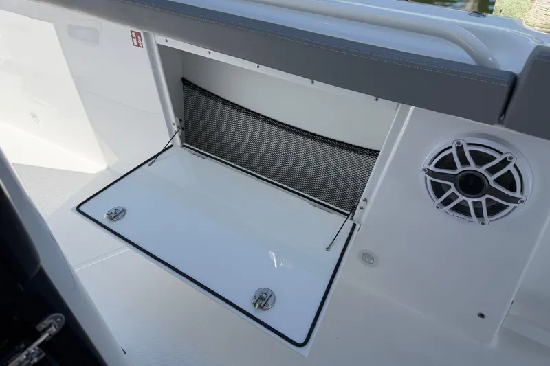Slide: The Image of Storage compartment and speaker on 2026 Everglades 395 Center Console boat. - 71