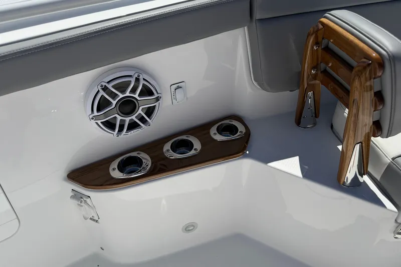 Slide: The Image of Interior of 2026 Everglades 395 Center Console boat with speaker and cup holders. - 83