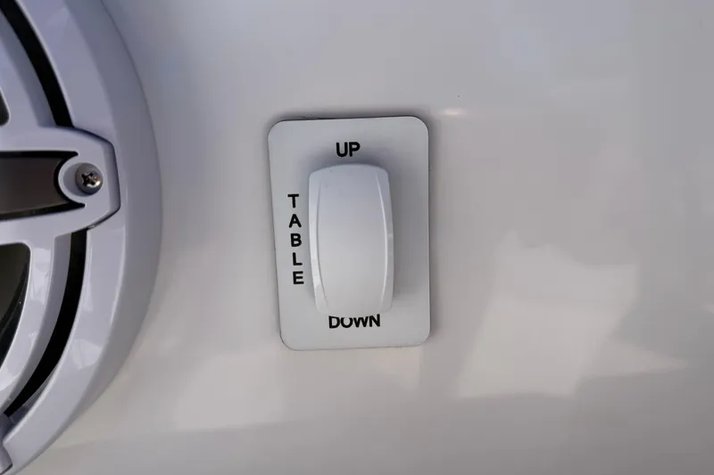 Slide: The Image of Switch for table adjustment on 2026 Everglades 395 Center Console boat. - 84