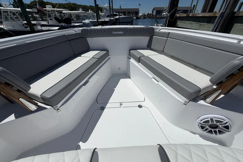 Slide: The Image of Luxurious seating area on 2026 Everglades 395 Center Console boat, docked at marina. - 85