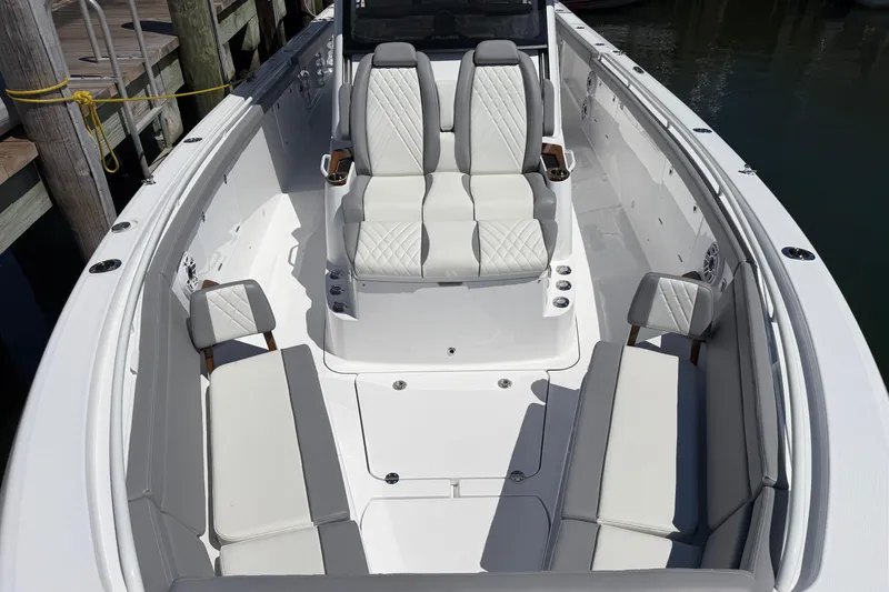 Slide: The Image of 2026 Everglades 395 Center Console boat interior with luxurious seating and modern design. - 91