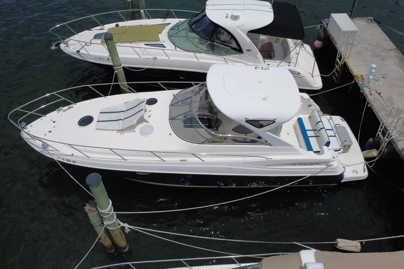Slide: The Image of 2006 Regal Commodore 3560 yacht docked at marina, aerial view. - 2