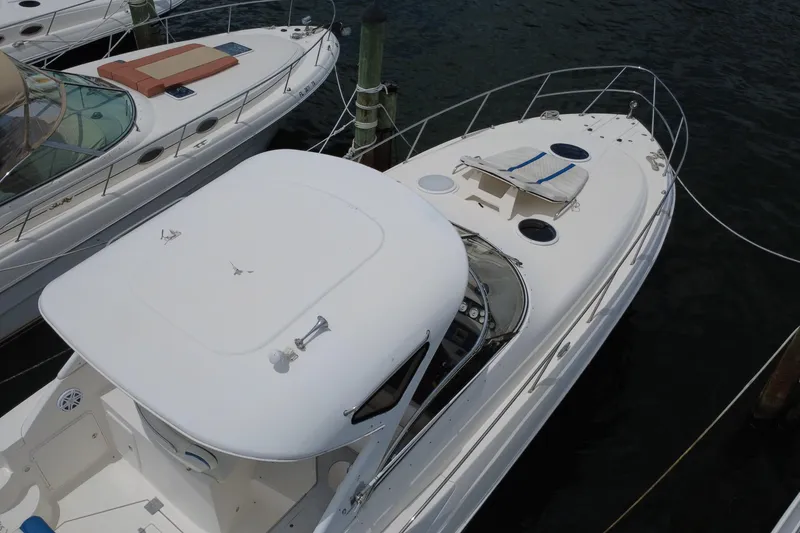 Slide: The Image of 2006 Regal Commodore 3560 yacht docked, aerial view of sleek white design. - 5