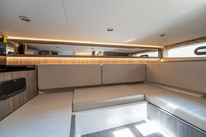 Slide: The Image of Interior of a Sea Ray Sundancer 370 Outboard with sleek upholstery and modern lighting. - 28