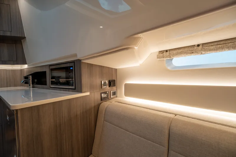 Slide: The Image of Interior of a modern yacht with sleek kitchen and cozy seating area. - 42
