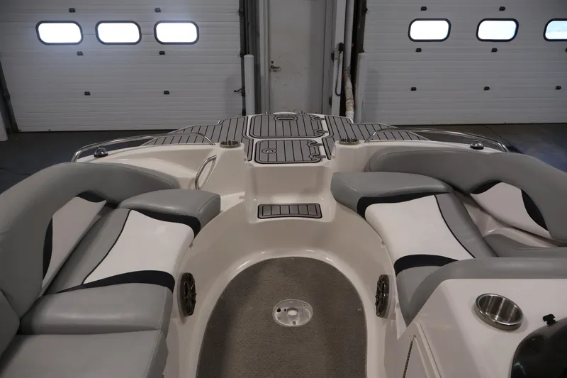 Slide: The Image of 2015 Starcraft Star Step 220 I/O boat interior with cushioned seating and sleek design. - 13