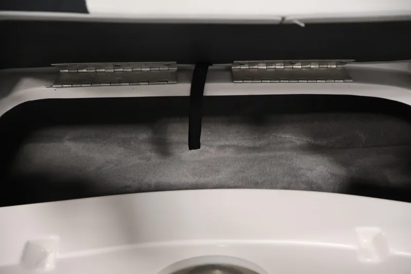 Slide: The Image of Storage compartment of a 2015 Starcraft Star Step 220 I/O boat, featuring metal hinges. - 14