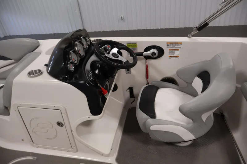 Slide: The Image of 2015 Starcraft Star Step 220 I/O boat cockpit with steering wheel and gauges. - 17