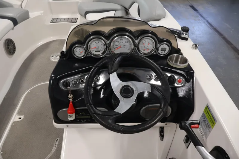 Slide: The Image of Dashboard of a 2015 Starcraft Star Step 220 I/O boat with steering wheel and gauges. - 19