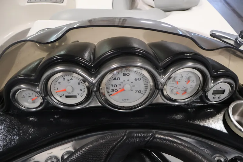 Slide: The Image of Dashboard of 2015 Starcraft Star Step 220 I/O boat with gauges and controls. - 21