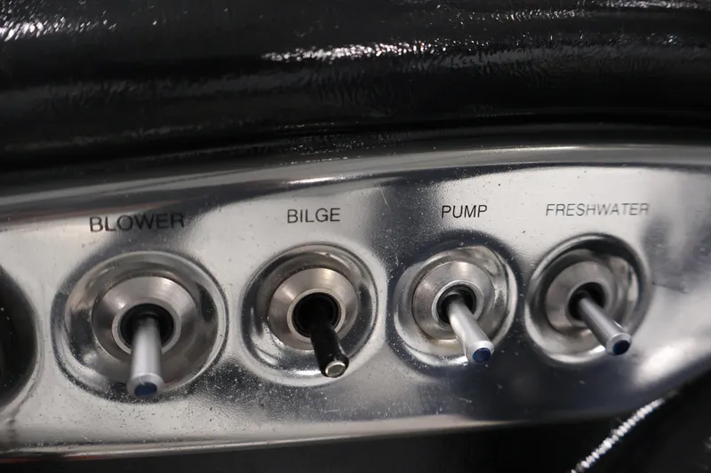 Slide: The Image of Control panel switches on a 2015 Starcraft Star Step 220 I/O boat. - 22