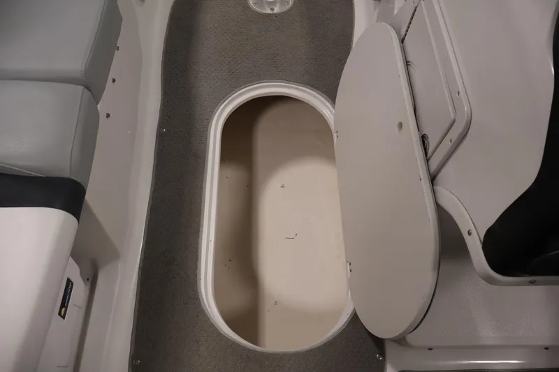 Slide: The Image of Open storage compartment in 2015 Starcraft Star Step 220 I/O boat interior. - 31