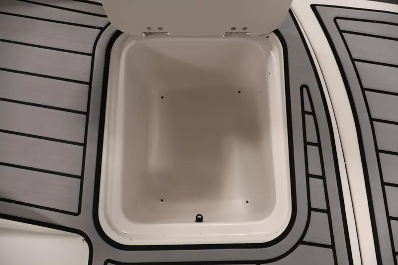 Slide: The Image of Storage compartment on 2015 Starcraft Star Step 220 I/O boat with gray decking. - 42