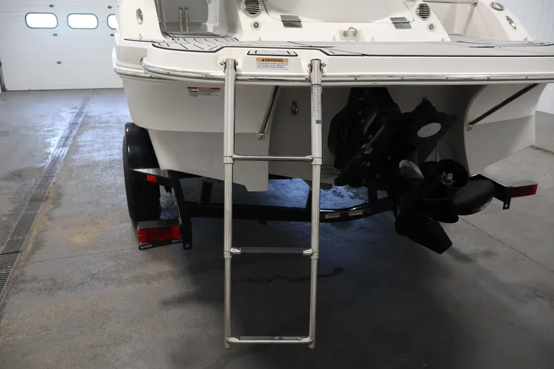 Slide: The Image of Rear view of a 2015 Starcraft Star Step 220 I/O boat with ladder and propeller. - 43