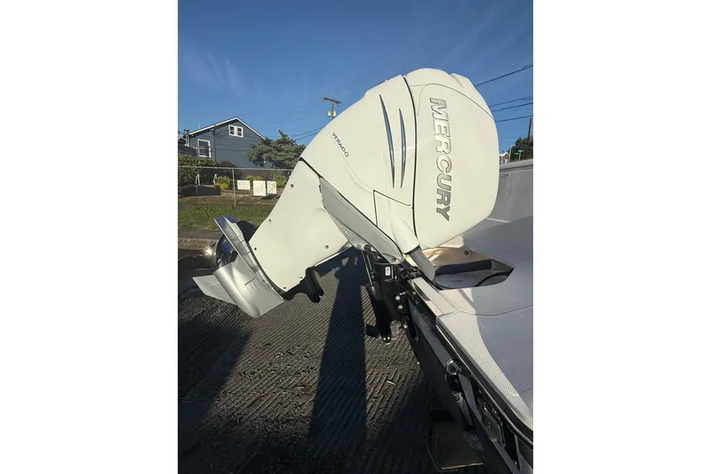 Slide: The Image of Outboard motor on a 2016 Pursuit DC 265 Dual Console boat, featuring a Mercury Verado engine. - 3