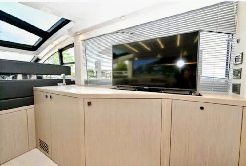 Slide: The Image of Interior of Sunseeker Predator 50 yacht with TV and cabinets. - 27