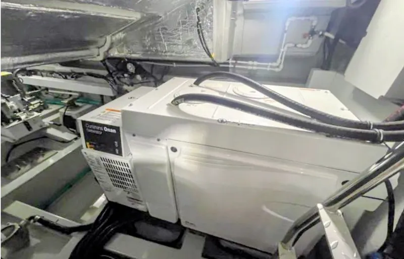 Slide: The Image of Cummins Onan generator in the engine room of a 2019 Sunseeker Predator 50. - 42