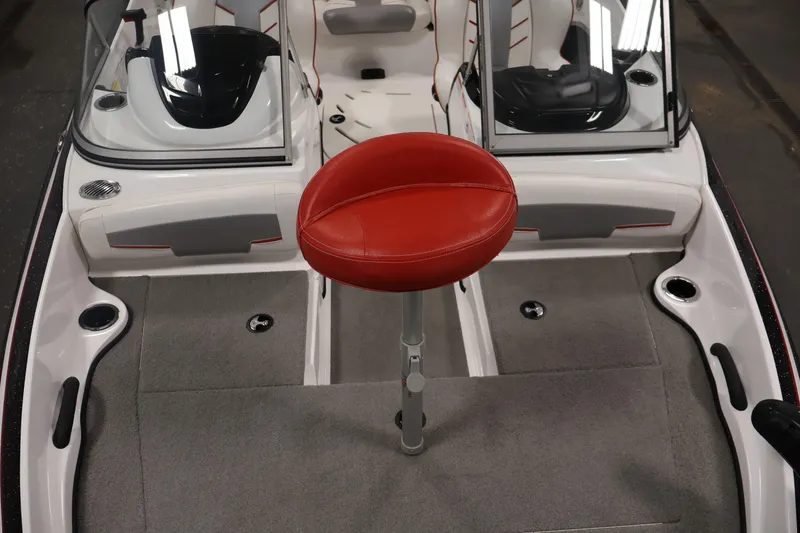 Slide: The Image of 2019 Nitro Z19 Sport boat interior with red seat and dual consoles. - 15