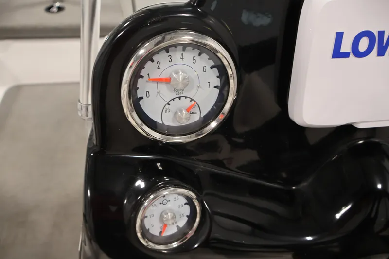 Slide: The Image of Close-up of 2019 Nitro Z19 Sport boat gauges, displaying RPM and speed indicators. - 23