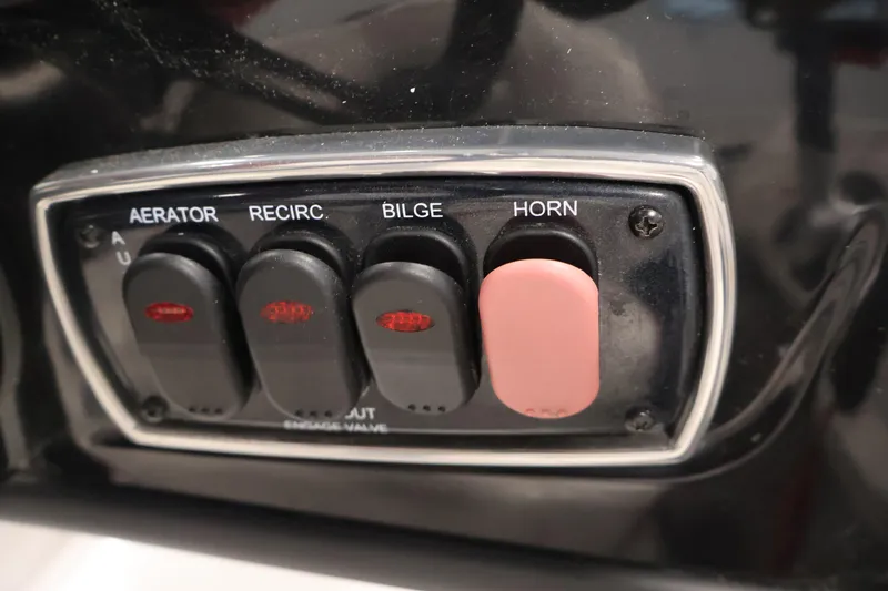 Slide: The Image of Control panel of a 2019 Nitro Z19 Sport boat with switches for aerator, recirculation, bilge, and horn. - 28
