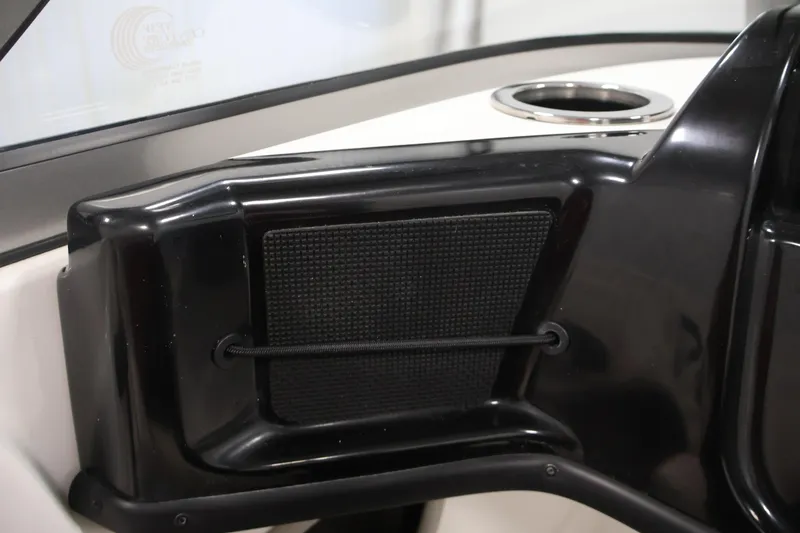 Slide: The Image of Interior detail of a 2019 Nitro Z19 Sport boat, featuring a black panel and cup holder. - 34
