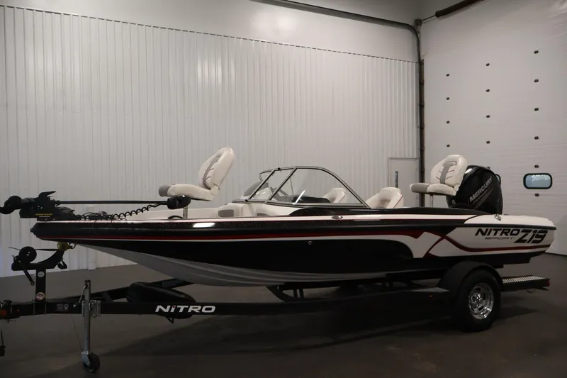 Slide: The Image of 2019 Nitro Z19 Sport boat in showroom, featuring sleek design and modern seating. - 44