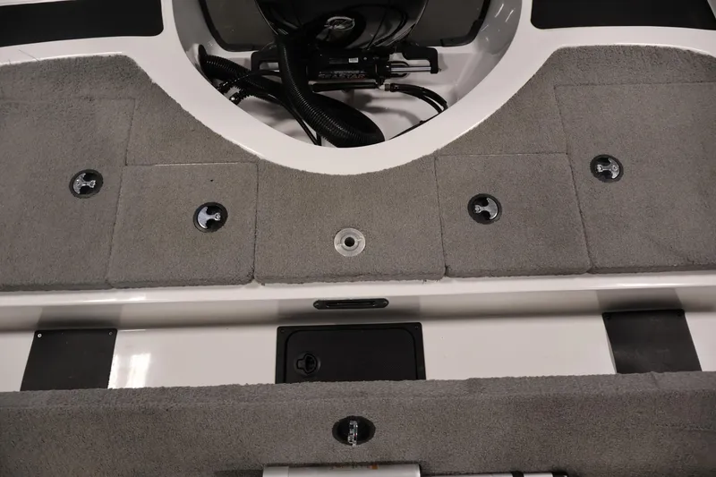 Slide: The Image of 2019 Nitro Z19 Sport boat interior with gray carpet and storage compartments. - 46