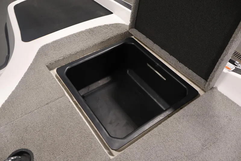 Slide: The Image of Open storage compartment in 2019 Nitro Z19 Sport boat, featuring carpeted interior. - 49