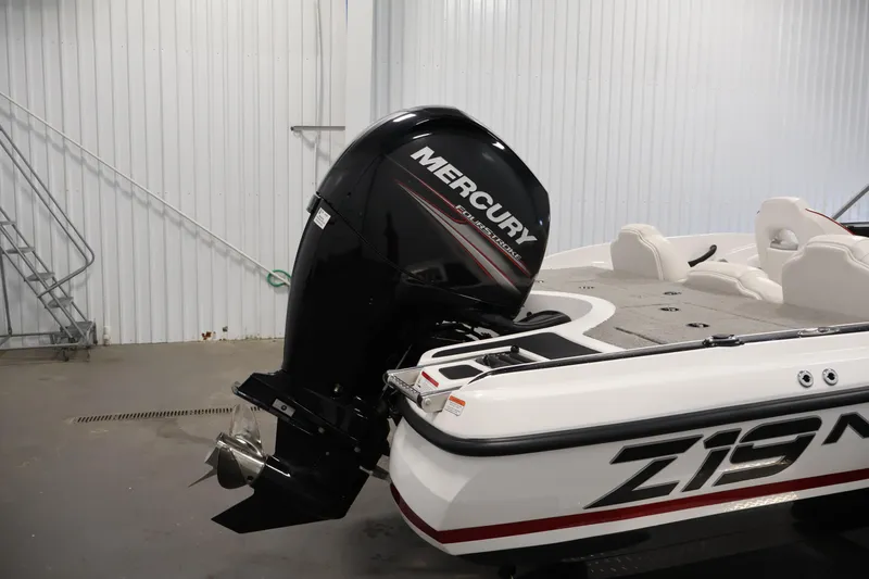 Slide: The Image of 2019 Nitro Z19 Sport boat with Mercury outboard motor in a garage setting. - 54