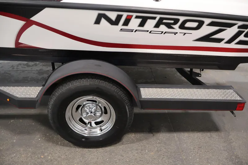 Slide: The Image of 2019 Nitro Z19 Sport trailer with chrome wheel and diamond plate step. - 60