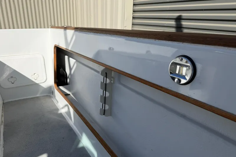 Slide: The Image of 1986 Radon 21 Sport boat interior with wood trim and metal fixtures. - 10