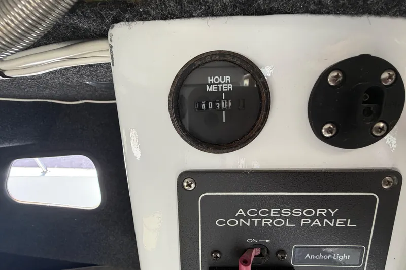 Slide: The Image of Hour meter and accessory control panel on 1986 Radon 21 Sport boat. - 13