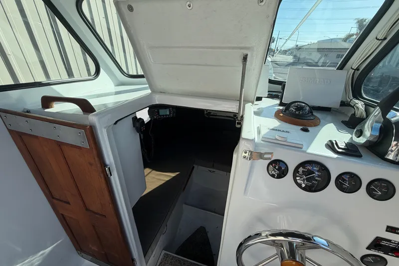 Slide: The Image of Interior view of a 1986 Radon 21 Sport boat cockpit with navigation instruments. - 19