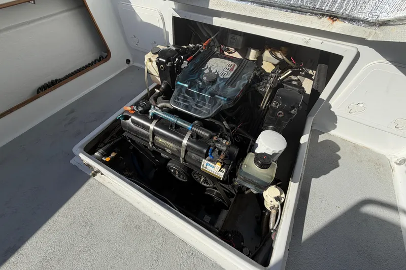 Slide: The Image of Engine compartment of a 1986 Radon 21 Sport boat, showcasing detailed mechanical components. - 26