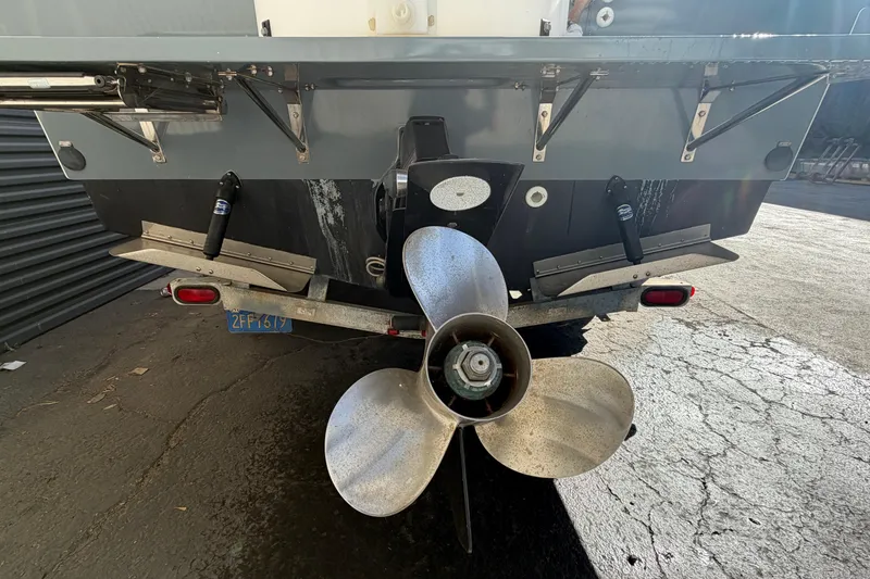 Slide: The Image of Rear view of 1986 Radon 21 Sport boat with large propeller and trailer. - 30