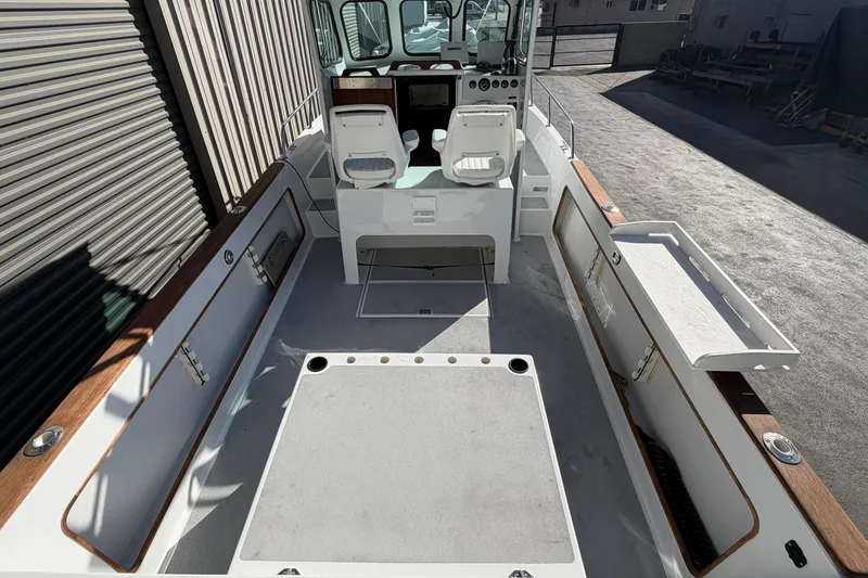 Slide: The Image of 1986 Radon 21 Sport boat interior with seating and storage compartments. - 4