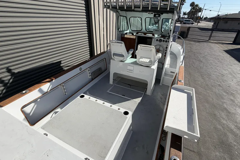 Slide: The Image of 1986 Radon 21 Sport boat interior with dual seats and control panel. - 5