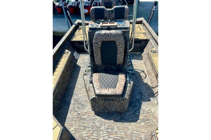Slide: The Image of 2025 Xpress H22B Bay boat interior with patterned seating and console design. - 30