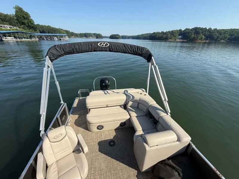 Slide: The Image of Harris Cruiser 230 pontoon boat on calm lake, year 2021. - 15